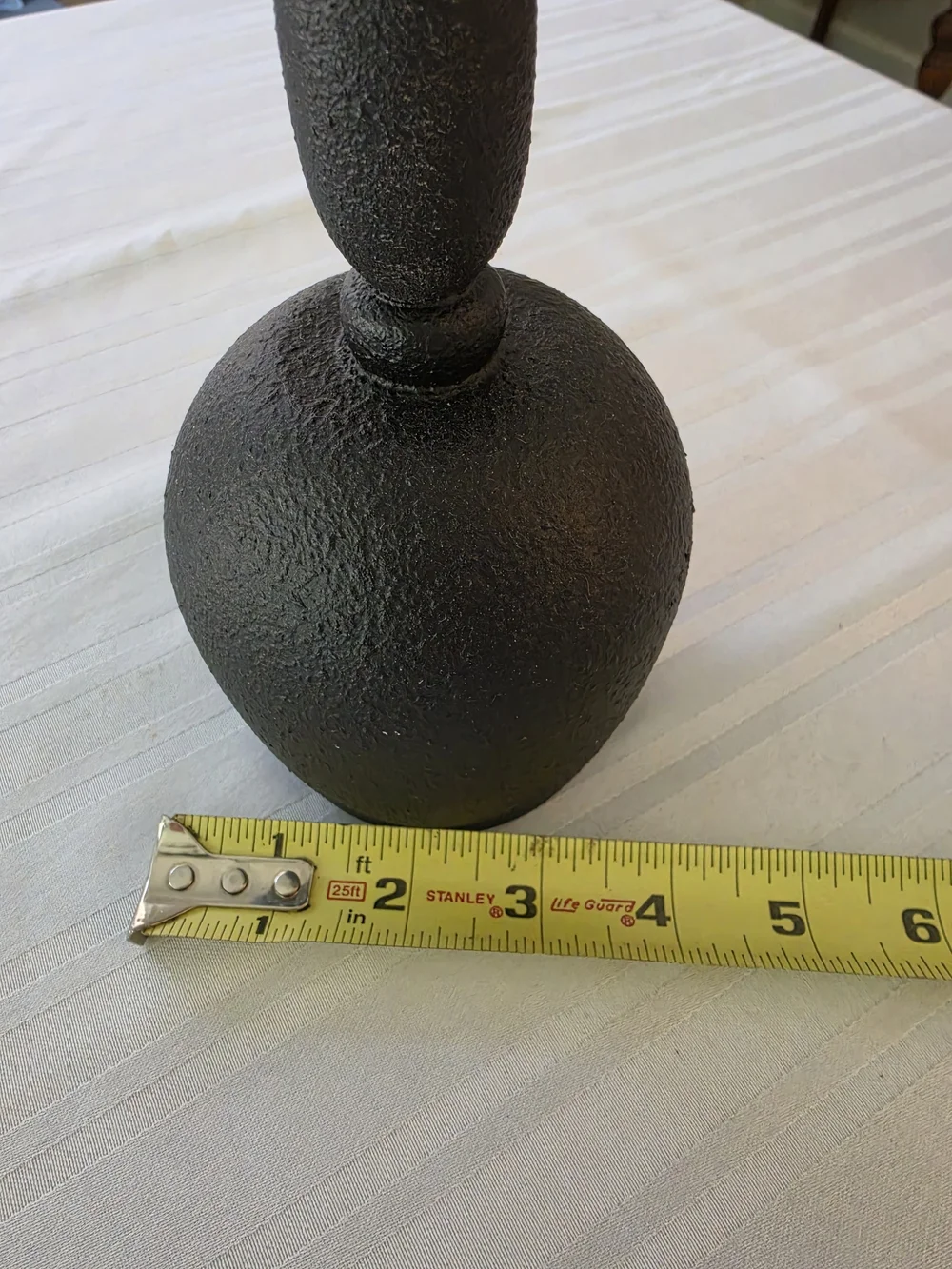Black and gold taper candlestick holder Bulbous base Sleek turned spindle neck